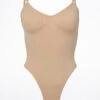 Bloch Seamless Thong Bodysuit -Dance costume bl l3147nud bloch seamless thong bodysuit tan front 96465.1678925951